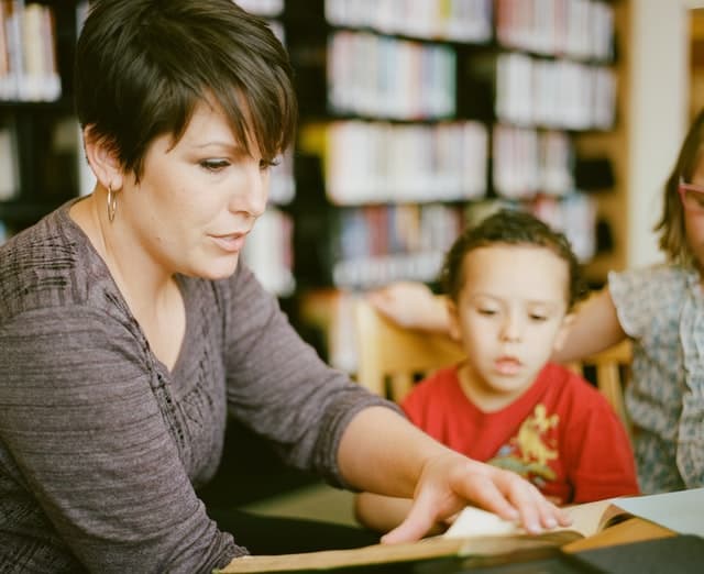 Educator reading with children