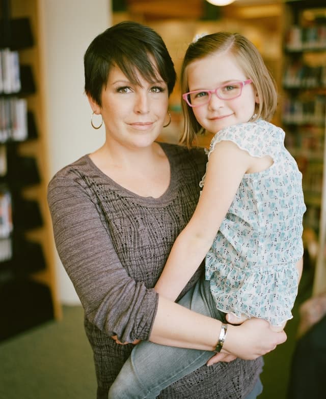 Parent carrying a child